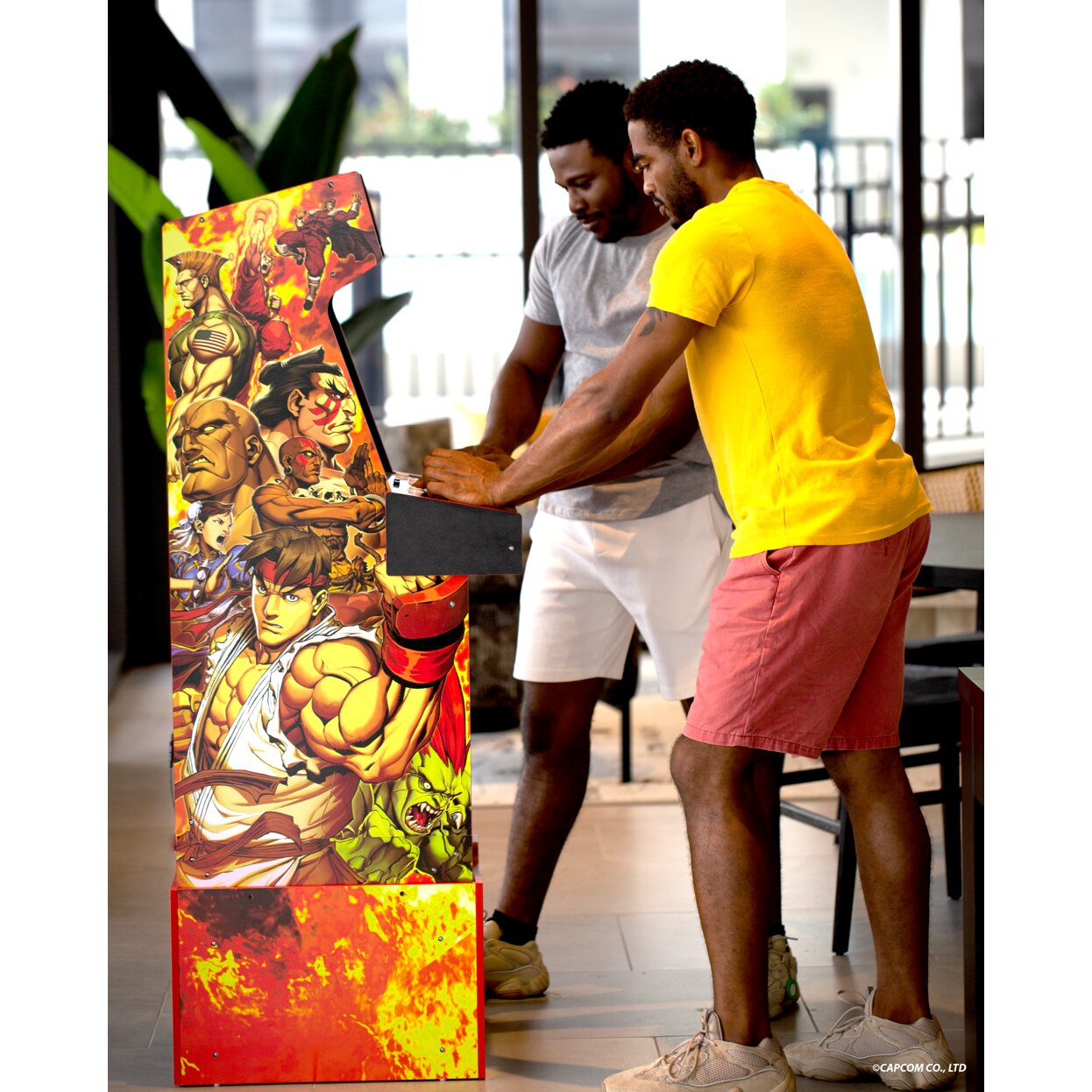 Consola verticala retro 14 jocuri ARCADE1UP, Capcom Legacy Yoga Flame Edition, H 154 cm, Wi-Fi LIVE Play, 2 jucatori, iluminare Marquee, display 17 inch, difuzor extern, accesoriu inaltare consola, multicolor