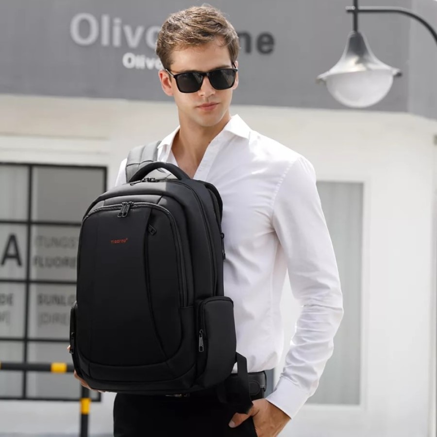 Rucsac laptop 15.6" smart casual, impermeabil, cu orificiu pentru cabluri audio si port USB, Tigernu, 33x17x49 cm, Negru